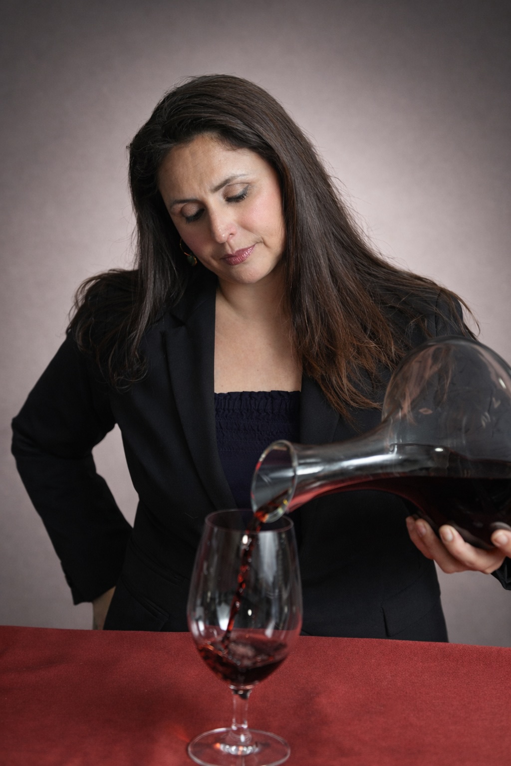 Cynthia pouring wine